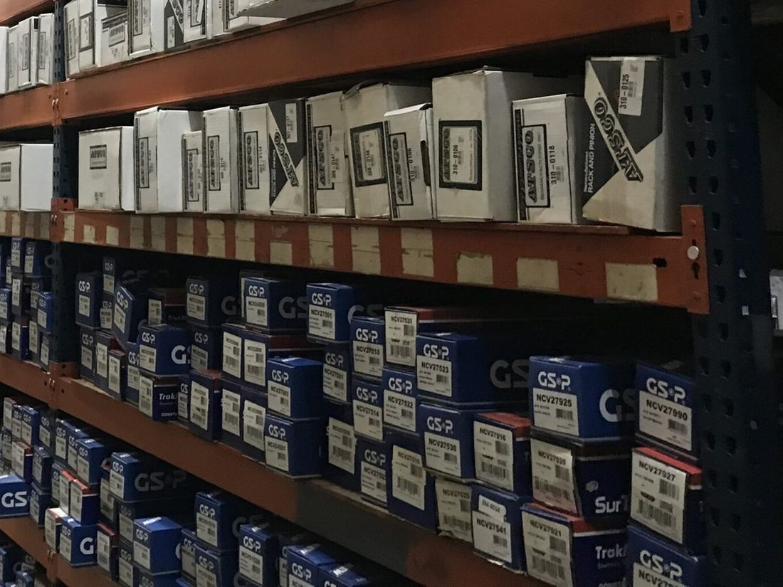 Shelves of boxed parts in the Manfield warehouse